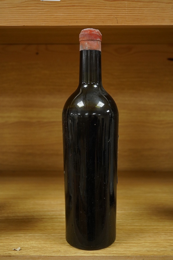 A bottle of Chateau Margaux 1934 Premier Grand Cru, Bordeaux, red wine. Condition - poor, level low and labels damaged, storage history unknown.